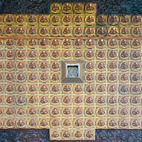 Admire the 112 serpent carvings on the Naga shrine. 